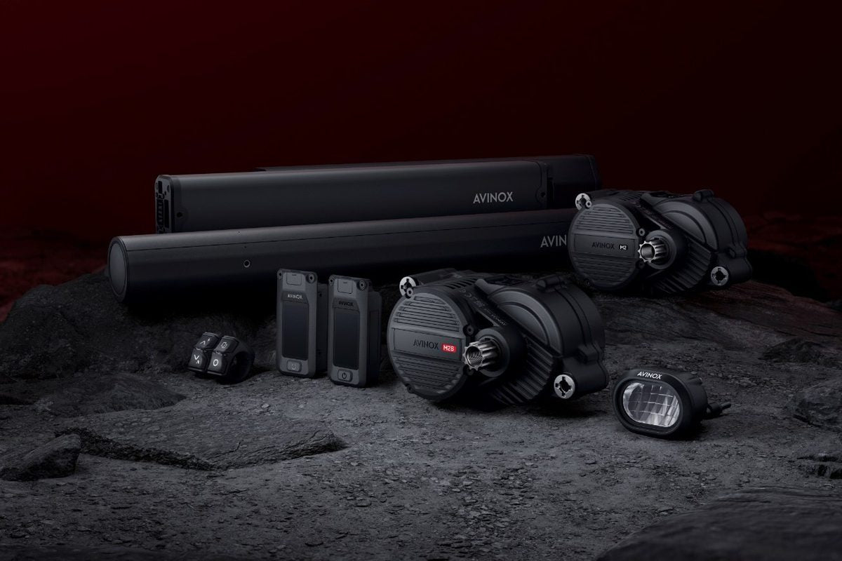 Avinox M2S and M2 mid-drive motor systems with batteries, displays, and controls laid out together