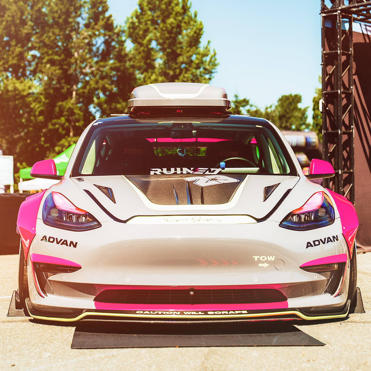 Custom modified Tesla Model 3 on ADVAN wheels and part of Ruined EV car club in the Showoff Zone at Demo Days Festival